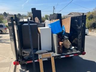 Trailer loaded with furniture and debris from a junk removal job in Warrenton VA